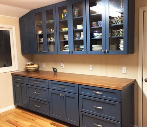 Rice Furniture & Design Center | custom blue dining room cabinets with glass doors and silver handles Rice Furniture & Design Center | custom blue dining room cabinets with glass doors and silver handles