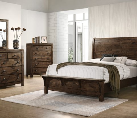 Rice Furniture & Design Center | dark wood bedroom furniture with white bedding in a white paneled room with a white brick accent wall Rice Furniture & Design Center | dark wood bedroom furniture with white bedding in a white paneled room with a white brick accent wall