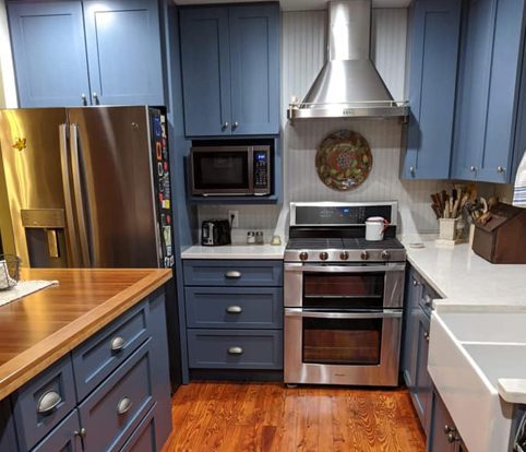 Rice Furniture & Design Center | Design Center custom built cabinets for a kitchen painted a dark blue with silver fixtures Rice Furniture & Design Center | Design Center custom built cabinets for a kitchen painted a dark blue with silver fixtures